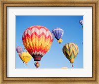 Framed Low angle view of hot air balloons in the sky