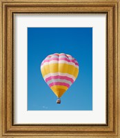 Framed Low angle view of a hot air balloon in the sky, Albuquerque, New Mexico, Yellow & Pink