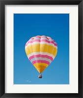 Framed Low angle view of a hot air balloon in the sky, Albuquerque, New Mexico, Yellow & Pink