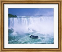 Framed High angle view of a tourboat in front of a waterfall, Niagara Falls, Ontario, Canada