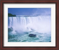 Framed High angle view of a tourboat in front of a waterfall, Niagara Falls, Ontario, Canada