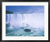 Framed High angle view of a tourboat in front of a waterfall, Niagara Falls, Ontario, Canada