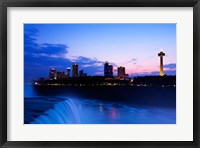 Framed Waterfall with buildings lit up at dusk, American Falls, Niagara Falls, City of Niagara Falls, New York State, USA