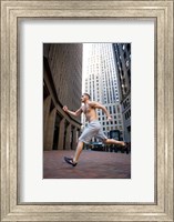 Framed Side profile of a young man running in a city