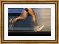 Framed Low section view of a person running on blue