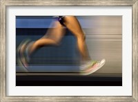 Framed Low section view of a person running on blue
