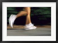 Framed Low Section View Of A Person Running In White Sneakers