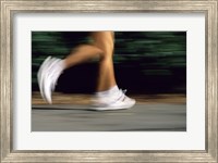 Framed Low Section View Of A Person Running In White Sneakers