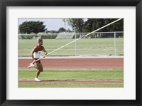 Framed Male athlete pole vaulting