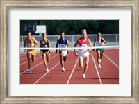 Framed Male athletes running on a running track
