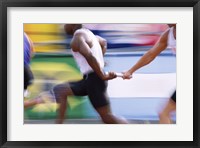 Framed Side profile of three men passing a relay baton