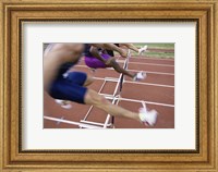 Framed Side profile of three people jumping a hurdle