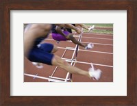 Framed Side profile of three people jumping a hurdle