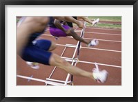 Framed Side profile of three people jumping a hurdle