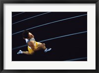 Framed High angle view of a young man running on a running track