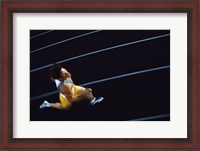 Framed High angle view of a young man running on a running track