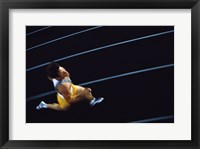 Framed High angle view of a young man running on a running track