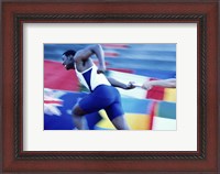 Framed Side profile of runners passing a baton in a relay race