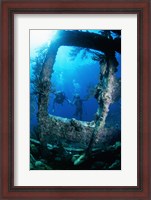 Framed Scuba diver investigating shipwrecks