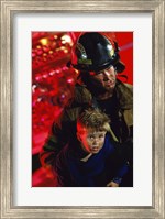 Framed Close-up of a firefighter carrying a boy