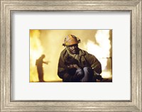 Framed Firefighter carrying a boy