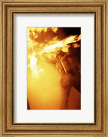 Framed Fireman fighting with fire flames
