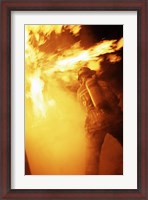 Framed Fireman fighting with fire flames