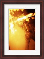 Framed Fireman fighting with fire flames