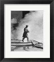 Framed Firefighter walking in front of smoke