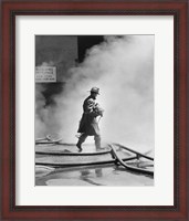 Framed Firefighter walking in front of smoke