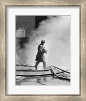 Framed Firefighter walking in front of smoke