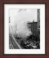 Framed New York City, Fire on East 47th Street, with fire engines shooting water on burning building