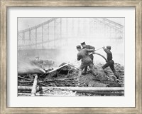 Framed Three firefighters extinguishing a fire