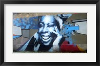 Framed Graffiti of blue smiling women with abstract background somewhere in Gdynia