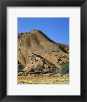 Framed Tourists climbing on a rock, Ayers Rock, Uluru-Kata Tjuta National Park, Australia