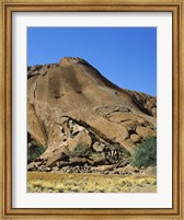 Framed Tourists climbing on a rock, Ayers Rock, Uluru-Kata Tjuta National Park, Australia