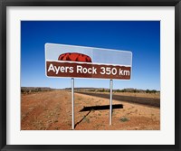 Framed Distance sign on the road side, Ayers Rock, Uluru-Kata Tjuta National Park, Australia