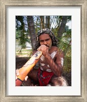 Framed Pamagirri aborigine playing a didgeridoo, Australia