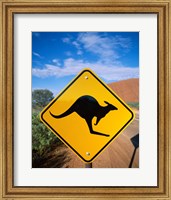 Framed Kangaroo sign on a road with a rock formation in the background, Ayers Rock