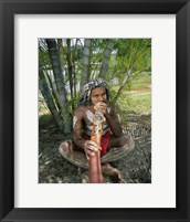 Framed Aborigine playing a didgeridoo, Cairns, Queensland, Australia