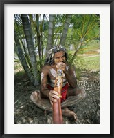 Framed Aborigine playing a didgeridoo, Cairns, Queensland, Australia