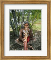 Framed Aborigine playing a didgeridoo, Cairns, Queensland, Australia