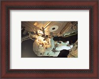 Framed Astronaut Sellers Working on ISS