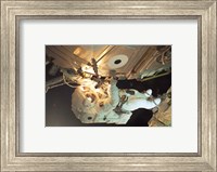 Framed Astronaut Sellers Working on ISS