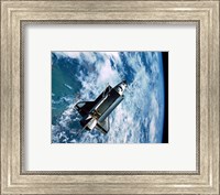 Framed Shuttle Discovery in Space