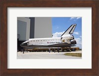 Framed STS-135 Atlantis approaches the VAB