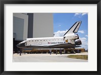 Framed STS-135 Atlantis approaches the VAB