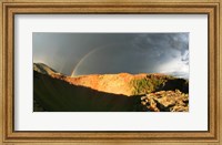 Framed Crater of an extinct volcano with a rainbow in the sky