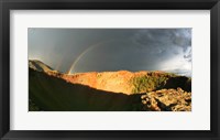 Framed Crater of an extinct volcano with a rainbow in the sky