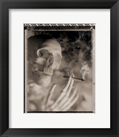 Framed Side profile of a skeleton holding a cigarette